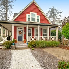Romantic Oregon Coast Escape with Porch, Fireplace & Garden Charm