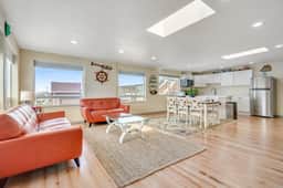 Light filled home in the heart of town with deck and with D steps to beach access - Image 5