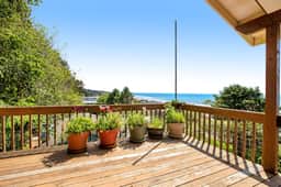 Limited Time Deals Coastal Hideaway with Ocean Views and Spacious Deck - Image 4