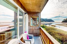 Creekside condo with beach access balcony full kitchen and ocean views - Image 2