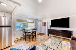 Quaint ocean view escape with modern interior smart TV and gorgeous deck - Image 2