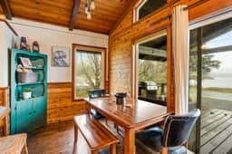 Rustic waterfront woodland lodge with impressive lake views from patio - Image 5