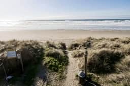 Coastal Paradise Awaits Spacious Retreat with Firepit and Entertainment - Image 3