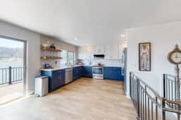 Bayview home with a deck overlooking the locally famous Ghost Hole fishing spot - Image 5