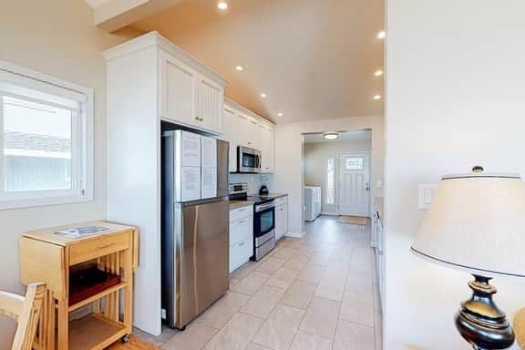 Beachfront home with ocean facing deck and ocean views throughout modern kitchen - Image 5
