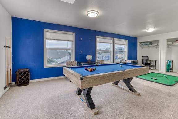 Ocean view home with pool table and fast WiFi steps to beach shops and eateries - Image 1