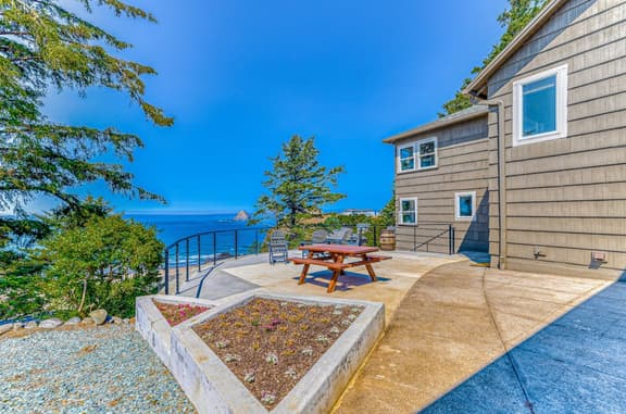 Quaint ocean view escape with modern interior smart TV and gorgeous deck - Image 1