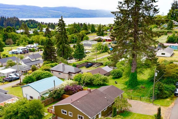 Water view retreat with scenic deck grill yard fireplace board games and with D - Image 1