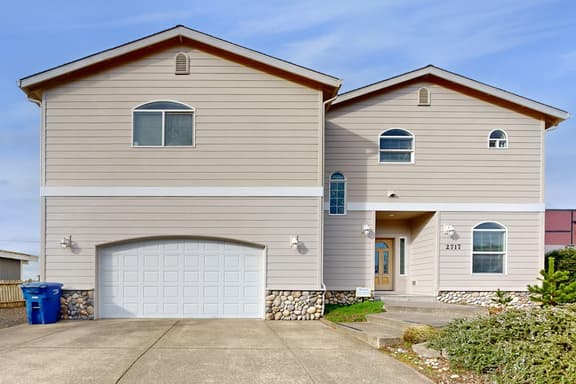 Spacious home close to the beach with peekaboo ocean views fireplaces hot tub - Image 1