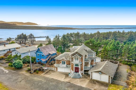 Coastal estate with private hot tub enclosed yard firepit and game room - Image 1